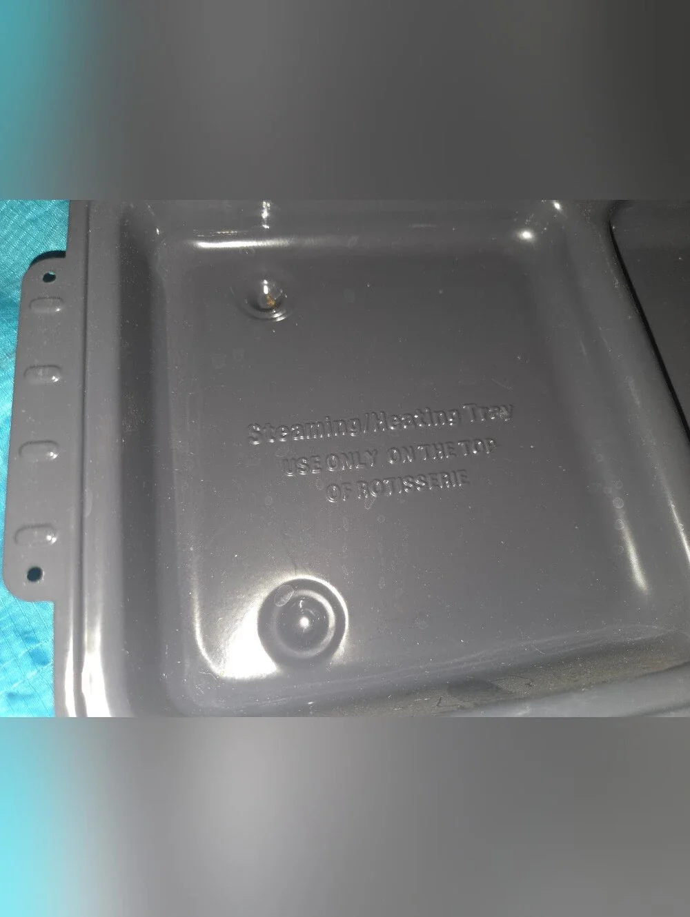 Rotisserie steaming heating tray and lid.